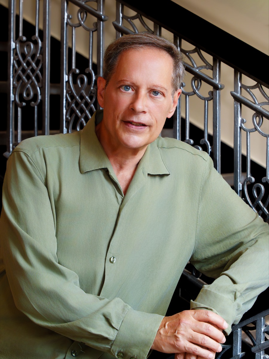 Friendly portrait of Michael Lewin wearing a green shirt