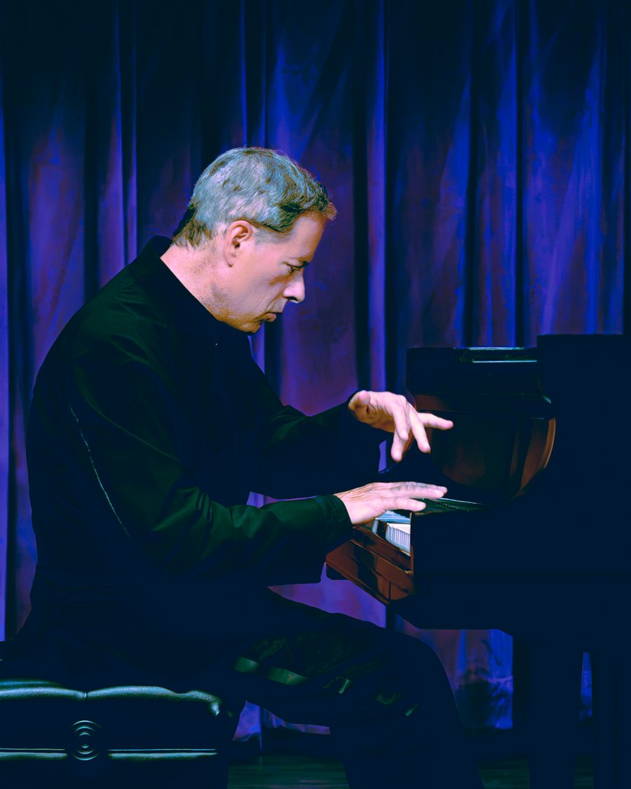 Michael Lewin performing at the piano